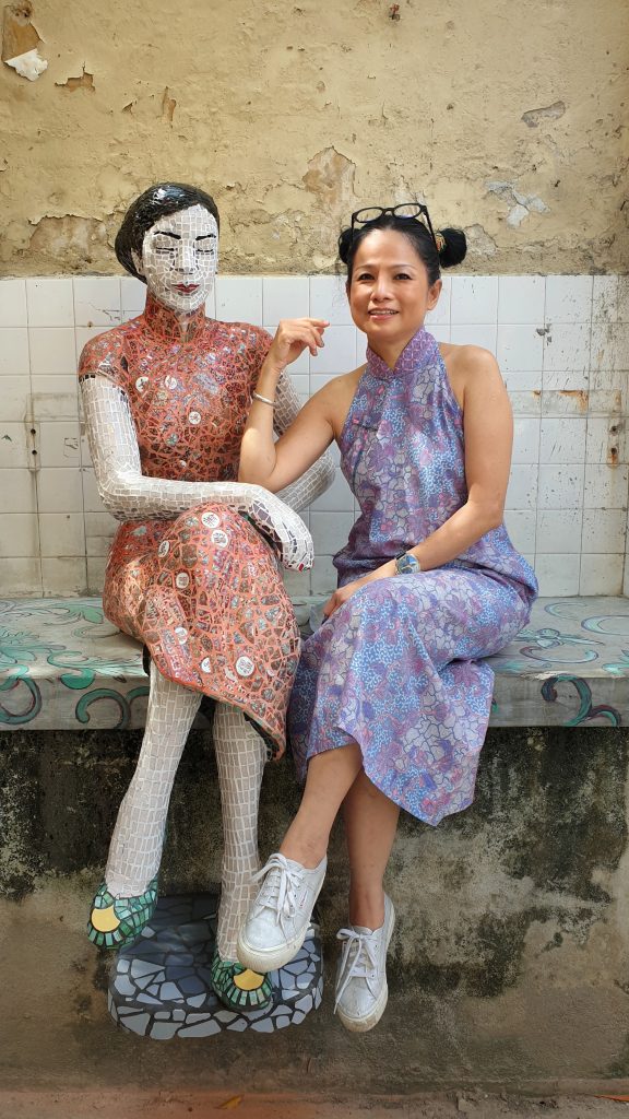 Alice Chang (Lai Lai Art Studio) with her sculpture called The Lady made from porcelain pieces